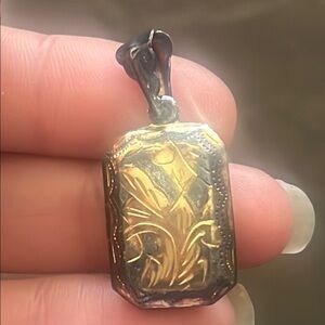 Vintage Sterling silver locket but has gold look to it pendant design
